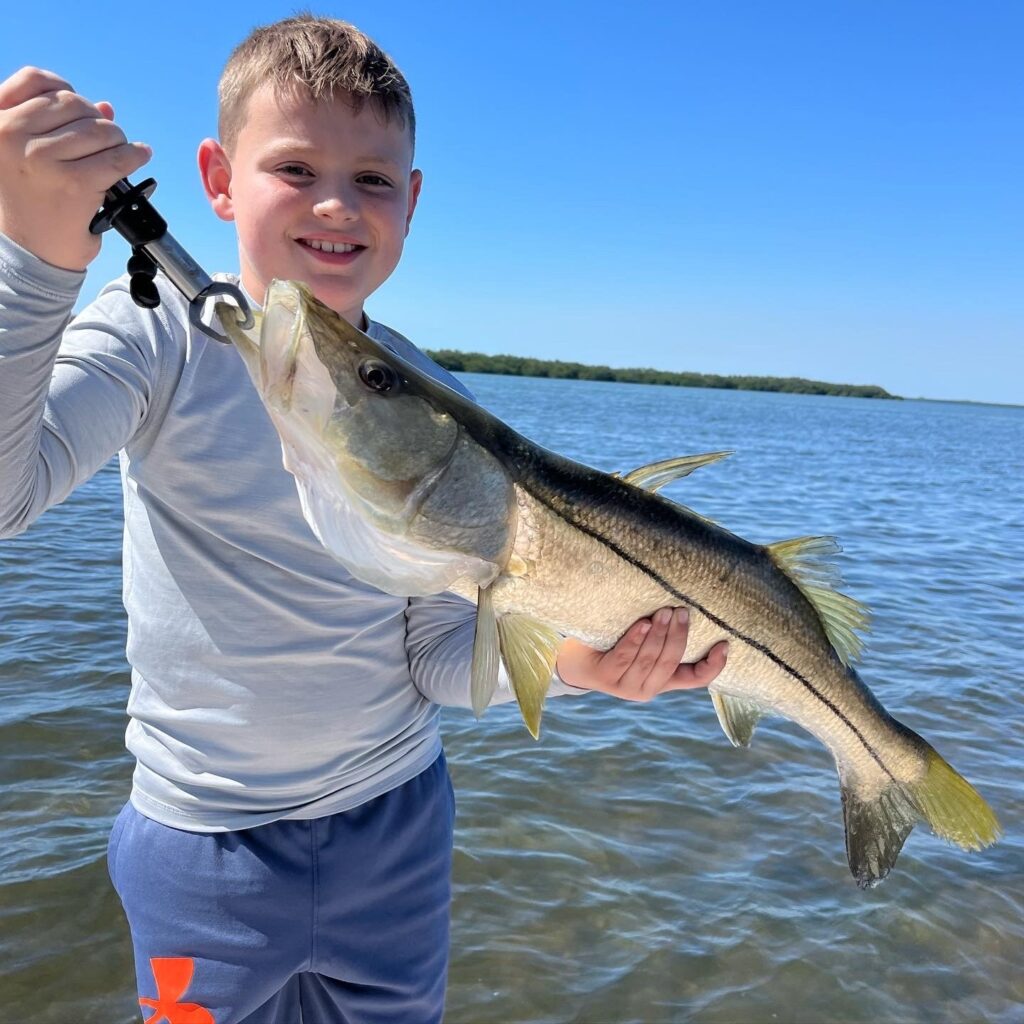 Boy with Snook Cape Coral Charter Fishing